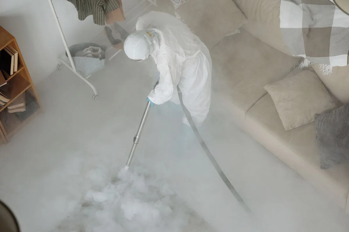 Biohazard cleanup technician in protective equipment, Cutlerville, MI